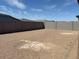Spacious backyard enclosed by block walls, providing privacy and security at 15989 W Cottontail Ln, Surprise, AZ 85387