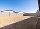 Backyard area ready for landscaping with block wall fencing for privacy at 16076 W Prickly Pear Trl, Surprise, AZ 85387
