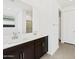 Bathroom featuring a double sink vanity and a large mirror at 16076 W Prickly Pear Trl, Surprise, AZ 85387