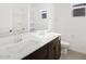 Modern bathroom with double sinks, sleek vanity, and a bright, clean aesthetic at 16076 W Prickly Pear Trl, Surprise, AZ 85387