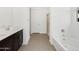 Bathroom showcasing double sinks, shower, and a soaking tub at 16076 W Prickly Pear Trl, Surprise, AZ 85387