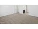 Carpeted bedroom with multiple doors offering access to other areas at 16076 W Prickly Pear Trl, Surprise, AZ 85387