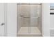 Glass shower with tile surround, offering modern bath fixtures at 16076 W Prickly Pear Trl, Surprise, AZ 85387