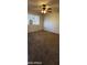Neutral carpeted bedroom with a ceiling fan and a window, creates a bright and functional space at 1706 W Village Way, Tempe, AZ 85282