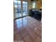 View of a kitchen and breakfast bar featuring ceramic tile floors at 1706 W Village Way, Tempe, AZ 85282