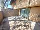 Enclosed patio with sliding glass door and privacy wall at 1706 W Village Way, Tempe, AZ 85282
