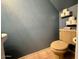 Efficient powder room with beige toilet and tile flooring, plus convenient wall-mounted toilet paper storage at 1706 W Village Way, Tempe, AZ 85282