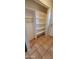 Functional closet with built-in shelves and convenient wire basket offers ample storage space at 1706 W Village Way, Tempe, AZ 85282