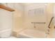 Accessible bathroom featuring a bathtub, shower, and grab bars at 1716 N Temple St, Mesa, AZ 85203