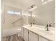 Well-lit bathroom with double sinks and modern fixtures at 1716 N Temple St, Mesa, AZ 85203