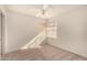Empty bedroom with carpet, fan and a large window for natural light at 1716 N Temple St, Mesa, AZ 85203