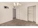 This bedroom is carpeted and features a fan and a closet at 1716 N Temple St, Mesa, AZ 85203
