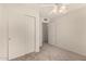 This bedroom is carpeted and includes a closet and a fan at 1716 N Temple St, Mesa, AZ 85203