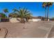 Well maintained desert landscape in front of a home with a brick sidewalk and palm trees at 1716 N Temple St, Mesa, AZ 85203
