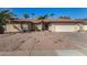 Charming single-story home with low-maintenance desert landscaping, palm trees and a two car garage at 1716 N Temple St, Mesa, AZ 85203