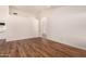 Spacious living room boasting hardwood floors, a view of the backyard and access to kitchen at 1716 N Temple St, Mesa, AZ 85203