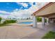 View of the backyard with a pool and covered patio area, great for entertaining or relaxing outdoors at 1934 E Hale St, Mesa, AZ 85203