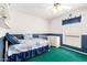 Bedroom with green carpet, traditional bed frame, blue accents, and natural light at 1934 E Hale St, Mesa, AZ 85203