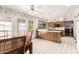 Spacious dining area with doors to backyard and pool, adjacent to kitchen at 1934 E Hale St, Mesa, AZ 85203