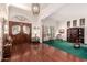 Spacious foyer with wood floors, a chandelier, and large front doors, offering a grand entrance to the home at 1934 E Hale St, Mesa, AZ 85203