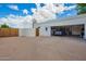 Spacious garage and driveway with ample parking space and a basketball hoop, perfect for outdoor activities at 1934 E Hale St, Mesa, AZ 85203