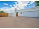 Spacious garage with a closed door, enhancing the property's curb appeal and providing secure parking at 1934 E Hale St, Mesa, AZ 85203