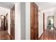 Traditional-style hallway featuring hardwood floors and vintage-inspired doors at 1934 E Hale St, Mesa, AZ 85203