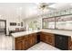 Bright kitchen with white countertops, wood cabinets, and easy access to the dining area at 1934 E Hale St, Mesa, AZ 85203