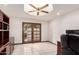 Home office with built in shelving and doors to patio at 1934 E Hale St, Mesa, AZ 85203