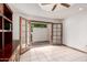 Home office with built in shelving and doors to patio at 1934 E Hale St, Mesa, AZ 85203