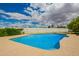 Refreshing backyard pool surrounded by lush greenery, offering a private oasis for relaxation and recreation at 1934 E Hale St, Mesa, AZ 85203