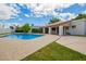 Inviting backyard pool and patio area with a covered outdoor seating area, perfect for relaxing and entertaining at 1934 E Hale St, Mesa, AZ 85203