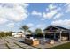 Backyard with a pool, outdoor seating area, gazebo, and fire pit at 19901 E Country Meadows Dr, Queen Creek, AZ 85142
