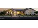Charming home exterior with well-manicured lawn, brick facade and inviting front porch at 19901 E Country Meadows Dr, Queen Creek, AZ 85142