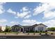 Charming single-story home with a brick facade, manicured lawn, and a welcoming entrance at 19901 E Country Meadows Dr, Queen Creek, AZ 85142