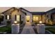 Charming home exterior with well-manicured lawn, brick facade and inviting front porch at 19901 E Country Meadows Dr, Queen Creek, AZ 85142