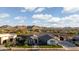 Stunning exterior view showcasing the home's architecture and desert landscaping and mountain views at 19901 E Country Meadows Dr, Queen Creek, AZ 85142