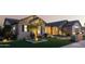 Charming home exterior with well-manicured lawn and a lush tree at 19901 E Country Meadows Dr, Queen Creek, AZ 85142