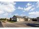 Detached garages and well maintained grounds highlight this modern ranch style home at 19901 E Country Meadows Dr, Queen Creek, AZ 85142