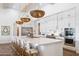 Bright, spacious kitchen features a large island with seating and modern stainless steel appliances at 19901 E Country Meadows Dr, Queen Creek, AZ 85142