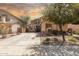 Charming home featuring a well-kept yard, lengthy driveway and inviting curb appeal with mature landscaping at 21557 N Anne Ln, Maricopa, AZ 85138