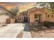 Attractive two-story home with a long driveway and desert landscaping offering curb appeal and neighborhood charm at 21557 N Anne Ln, Maricopa, AZ 85138