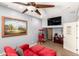 Charming home theater room with a large TV, popcorn machine, and comfortable seating for movie nights at 21557 N Anne Ln, Maricopa, AZ 85138