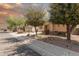 Well-maintained residence with desert landscaping, mature trees, and a tranquil setting on a quiet street at 21557 N Anne Ln, Maricopa, AZ 85138