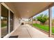 Covered back patio overlooking the backyard and lush green lawn at 2319 E San Tan Dr, Gilbert, AZ 85296