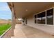Covered patio with views of the backyard, including a green lawn and block wall at 2319 E San Tan Dr, Gilbert, AZ 85296