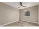 Bedroom featuring wood-look floors and a bright window at 2319 E San Tan Dr, Gilbert, AZ 85296