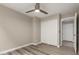 Bedroom with sliding closet doors and wood-look flooring at 2319 E San Tan Dr, Gilbert, AZ 85296