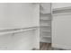 Organized walk-in closet with built-in shelving and hanging rods at 2319 E San Tan Dr, Gilbert, AZ 85296