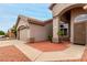Close-up of a home with front entrance, showcasing a well-kept landscape at 2319 E San Tan Dr, Gilbert, AZ 85296